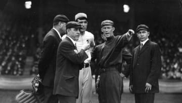 Before the start of game 1 of the 1914 World Series, team captains meet the umpires at home plate, with Johnny Evers, pointing. (Photo by Mark Rucker/Transcendental Graphics, Getty Images)