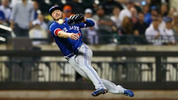 NEW YORK, NY - MAY 15: Josh Donaldson #20 of the Toronto Blue Jays is unable to throw out Juan Lagares #12 of the New York Mets in the fifth inning at Citi Field on May 15, 2018 in the Flushing neighborhood of the Queens borough of New York City. (Photo by Mike Stobe/Getty Images)