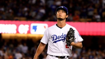 LOS ANGELES, CA - NOVEMBER 01: Yu Darvish #21 of the Los Angeles Dodgers walks to the dugout after being relieved during the second inning against the Houston Astros in game seven of the 2017 World Series at Dodger Stadium on November 1, 2017 in Los Angeles, California. (Photo by Harry How/Getty Images)