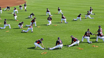 LAKE BUENA VISTA, FL - FEBRUARY 21: The Atlanta Braves stretch during a spring training workout at Champion Stadium on February 21, 2011 in Lake Buena Vista, Florida. (Photo by Mike Ehrmann/Getty Images)