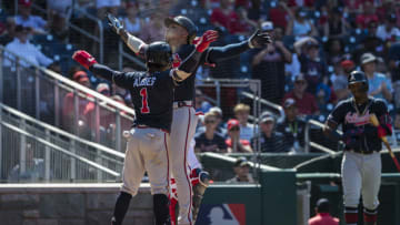 WASHINGTON, DC - JUNE 23: Johan Camargo #17 of the Atlanta Braves celebrates with Ozzie Albies #1 after hitting a two-run home run against the Washington Nationals during the tenth inning at Nationals Park on June 23, 2019 in Washington, DC. (Photo by Scott Taetsch/Getty Images)