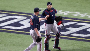 ARLINGTON, TEXAS - OCTOBER 18: Tyler Matzek #68 and Travis d'Arnaud #16 of the Atlanta Braves celebrate after retiring the side against the Los Angeles Dodgers during the fourth inning in Game Seven of the National League Championship Series at Globe Life Field on October 18, 2020 in Arlington, Texas. (Photo by Ron Jenkins/Getty Images)