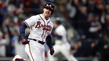 Dansby Swanson of the Atlanta Braves celebrates as he rounds the News  Photo - Getty Images