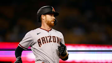 LOS ANGELES, CALIFORNIA - SEPTEMBER 19: Jordan Luplow #8 of the Arizona Diamondbacks singles against the Los Angeles Dodgers in the secondinning at Dodger Stadium on September 19, 2022 in Los Angeles, California. (Photo by Ronald Martinez/Getty Images)
