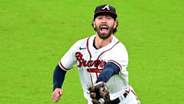 Dansby Swanson #7 of the Atlanta Braves catches an out against the Philadelphia Phillies during the sixth inning in game two of the National League Division Series at Truist Park. (Photo by Adam Hagy/Getty Images)