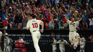 David Ross #8 celebrates as Chipper Jones #10 of the Atlanta Braves hit a three-run walk-off home run against the Philadelphia Phillies. (Photo by Scott Cunningham/Getty Images)
