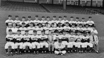 NEW YORK - SEPTEMBER 23, 1954: Members of the New York Giants pose for a team portrait on September 23, 1954 at the Polo Grounds in New York, New York. (L to R) (front row) Johnny Antonelli, Sal Maglie, Whitey Lockman, Larry Jansen, coach Fred Fitzsimmons, secretary Ed Brannick, manager Leo Durocher, coach Frank Shellenback, coach Herman Franks, Davey Williams, Hank Thompson, tean physician Dr. Anthony Palermo; (second row) clubhous custodian Ed Logan, Hoyt Wilhelm, Dusty Rhodes, Willie Mays, Don Mueller, Alvin Dark, Monte Irvin, Bill Taylor, Bobby Hofman, Joe Garagiola, Ruben Gomez, trainer Frank Bowman; Paul Giel, Joe Amalfitano, Don Liddle, Billy Gardner, Al Worthington, Foster Castleman, John "Windy" McCall, Alex Konikowski, Al Corwin, Marv Grissom, Ray Katt, George Spencer, Wes Westrum, Jim Hearn. (Photo by: Olen Collection/Diamond Images/Getty Images)