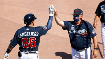 Mississippi / Atlanta Braves catcher Shea Langeliers (86) is greeted by hitting coach Kevin Seitzer during a Spring game. Mandatory Credit: Nathan Ray Seebeck-USA TODAY Sports