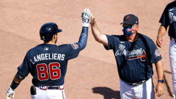 Mississippi / Atlanta Braves catcher Shea Langeliers (86) is greeted by hitting coach Kevin Seitzer during a Spring game. Mandatory Credit: Nathan Ray Seebeck-USA TODAY Sports