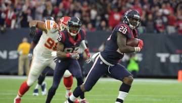 Jan 9, 2016; Houston, TX, USA; Houston Texans running back Alfred Blue (28) carries the ball against the Kansas City Chiefs in the second quarter in a AFC Wild Card playoff football game at NRG Stadium. Mandatory Credit: Kirby Lee-USA TODAY Sports