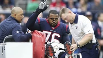 Jan 3, 2016; Houston, TX, USA; Houston Texans tackle Duane Brown (76) waves to the crowd after being carted off the field after an injury during the first quarter against the Jacksonville Jaguars at NRG Stadium. Mandatory Credit: Troy Taormina-USA TODAY Sports