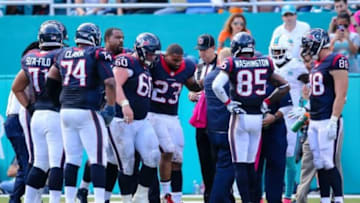 Oct 25, 2015; Miami Gardens, FL, USA; Houston Texans running back Arian Foster (23) is helped off the field after being injured against the Miami Dolphins during the second half at Sun Life Stadium. The Dolphins won 44-26. Mandatory Credit: Steve Mitchell-USA TODAY Sports