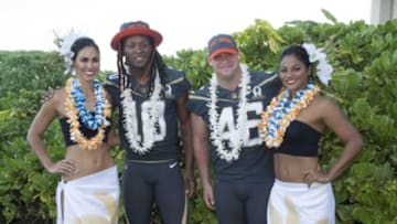 January 29, 2016; Kahuku, HI, USA; Hawaiian hostesses Chelsea Hardin (far left) and Mahina Garcia (far right) pose with Team Irvin wide receiver DeAndre Hopkins of the Houston Texans (10) and Team Irvin long snapper Jon Weeks of the Houston Texans (46) during 2016 Pro Bowl photo day at Turtle Bay Resort. Mandatory Credit: Kyle Terada-USA TODAY Sports