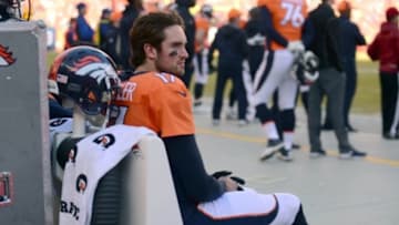 Jan 3, 2016; Denver, CO, USA; Denver Broncos quarterback Brock Osweiler (17) rests on the bench in the first quarter against the San Diego Chargers at Sports Authority Field at Mile High. Mandatory Credit: Ron Chenoy-USA TODAY Sports