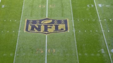 Oct 4, 2015; London, United Kingdom; General view of NFL golden shield logo at midfield at Wembley Stadium to commemorate Super Bowl 50 before Game 12 of the NFL International Series between the New York Jets and Miami Dolphins. Mandatory Credit: Kirby Lee-USA TODAY Sports