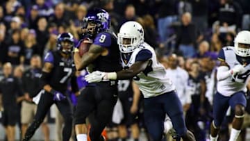 Oct 29, 2015; Fort Worth, TX, USA; TCU Horned Frogs wide receiver Josh Doctson (9) makes the catch in front of West Virginia Mountaineers safety KJ Dillon (9) during the second half of a game at Amon G. Carter Stadium. Mandatory Credit: Ray Carlin-USA TODAY Sports