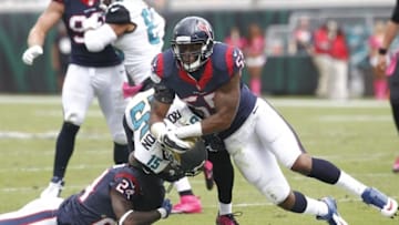 Oct 18, 2015; Jacksonville, FL, USA; Jacksonville Jaguars wide receiver Allen Robinson (15) is tackled by Houston Texans inside linebacker Benardrick McKinney (55) and cornerback Johnathan Joseph (24) during the second half of a football game at EverBank Field. Mandatory Credit: Reinhold Matay-USA TODAY Sports