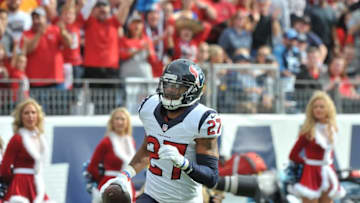 Dec 27, 2015; Nashville, TN, USA; Houston Texans strong safety Quintin Demps (27) picks up the ball fumbled by Tennessee Titans running back Antonio Andrews (26) (not pictured) and runs for a touchdown during the first half at Nissan Stadium. Mandatory Credit: Jim Brown-USA TODAY Sports