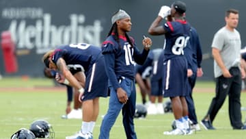 May 31, 2016; Houston, TX, USA. Houston Texans wide receiver DeAndre Hopkins (10) stretches out during Houston Texans
