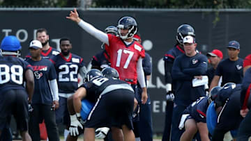 Jun 14, 2016; Houston, TX, USA; Houston Texans quarterback Brock Osweiler (17) signals to teammates in an offensive team drill during Houston Texans minicamp at Methodist Training Center in Houston, TX. Mandatory Credit: Erik Williams-USA TODAY Sports
