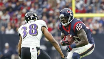 Dec 21, 2014; Houston, TX, USA; Houston Texans wide receiver Andre Johnson (80) looks to make a move on Baltimore Ravens defensive back Rashaan Melvin (38) during the first quarter at NRG Stadium. Mandatory Credit: Kevin Jairaj-USA TODAY Sports