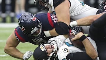 Jan 3, 2016; Houston, TX, USA; Jacksonville Jaguars quarterback Blake Bortles (5) is sacked by Houston Texans defensive end J.J. Watt (99) during the third quarter at NRG Stadium. The Texans won 30-6. Mandatory Credit: Troy Taormina-USA TODAY Sports