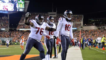 Nov 16, 2015; Cincinnati, OH, USA; Houston Texans wide receiver DeAndre Hopkins (10) celebrates with tackle Duane Brown (76) and wide receiver Cecil Shorts (18) after scoring on a 22-yard touchdown pass in the fourth quarter against the Cincinnati Bengals during a NFL football game at Paul Brown Stadium. The Texans defeated the Bengals 10-6. Mandatory Credit: Kirby Lee-USA TODAY Sports