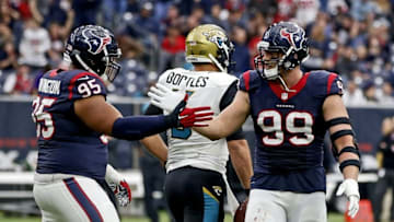 Jan 3, 2016; Houston, TX, USA; Houston Texans defensive end J.J. Watt (99) and defensive tackle Christian Covington (95) celebrate in front of Jacksonville Jaguars quarterback Blake Bortles (5) during the second half at NRG Stadium. Mandatory Credit: Kevin Jairaj-USA TODAY Sports