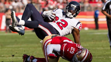 Aug 14, 2016; Santa Clara, CA, USA; Houston Texans running back Kenny Hilliard (22) is tackled by San Francisco 49ers strong safety Jaquiski Tartt (29) in the second quarter at Levi