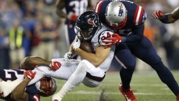 Sep 22, 2016; Foxborough, MA, USA; Houston Texans tight end Ryan Griffin (84) is tackled by New England Patriots safety Patrick Chung (23) and line backer Jonathan Freeny (55) during the second quarter at Gillette Stadium. Mandatory Credit: Greg M. Cooper-USA TODAY Sports