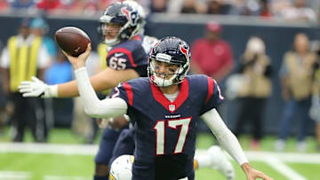 Nov 27, 2016; Houston, TX, USA; Houston Texans quarterback Brock Osweiler (17) passes the ball while tackled by San Diego Chargers linebacker Chris Landrum (46) in the second half at NRG Stadium. San Diego Chargers won 21 to 13. Mandatory Credit: Thomas B. Shea-USA TODAY Sports