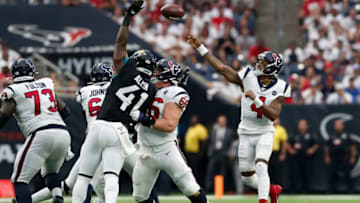 HOUSTON, TX - SEPTEMBER 15: Deshaun Watson #4 of the Houston Texans throws a pass under pressure by Josh Allen #41 of the Jacksonville Jaguars in the fourth quarter at NRG Stadium on September 15, 2019 in Houston, Texas. (Photo by Tim Warner/Getty Images)