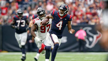 HOUSTON, TX - OCTOBER 06: Deshaun Watson #4 of the Houston Texans scrambles pursued by Grady Jarrett #97 of the Atlanta Falcons in the second half at NRG Stadium on October 6, 2019 in Houston, Texas. (Photo by Tim Warner/Getty Images)