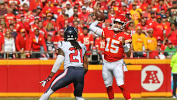 KANSAS CITY, MO - OCTOBER 13: Quarterback Patrick Mahomes #15 of the Kansas City Chiefs throws a pass against pressure from cornerback Bradley Roby #21 of the Houston Texans during the first quarter at Arrowhead Stadium on October 13, 2019 in Kansas City, Missouri. (Photo by Peter Aiken/Getty Images)