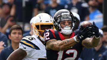 CARSON, CALIFORNIA - SEPTEMBER 22: Wide receiver Kenny Stills #12 of the Houston Texans makes a catch from quarterback Deshaun Watson #4 in front of defensive back Roderic Teamer #36 of the Los Angeles Chargers at Dignity Health Sports Park on September 22, 2019 in Carson, California. (Photo by Meg Oliphant/Getty Images)