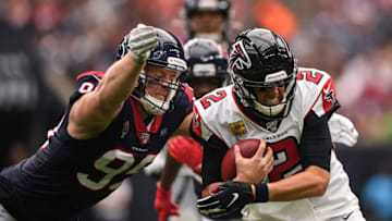 HOUSTON, TEXAS - OCTOBER 06: Matt Ryan #2 of the Atlanta Falcons is tackled by J.J. Watt #99 of the Houston Texans in the second quarter at NRG Stadium on October 06, 2019 in Houston, Texas. (Photo by Mark Brown/Getty Images)