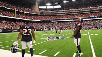HOUSTON, TEXAS - OCTOBER 06: Carlos Hyde #23 and Duke Johnson #25 of the Houston Texans celebrate an interception returned for a touchdown by Tashaun Gipson #39 in the foruth quarter against the Atlanta Falcons at NRG Stadium on October 06, 2019 in Houston, Texas. (Photo by Mark Brown/Getty Images)