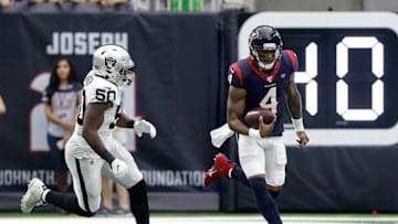 HOUSTON, TEXAS - OCTOBER 27: Deshaun Watson #4 of the Houston Texans runs past Nicholas Morrow #50 of the Oakland Raiders during the first half at NRG Stadium on October 27, 2019 in Houston, Texas. (Photo by Bob Levey/Getty Images)