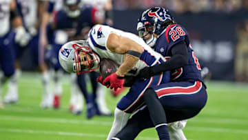 HOUSTON, TX - DECEMBER 1: Julian Edelman #11 of the New England Patriots catches a pass in the first half and is tackled by Vernon Hargreaves III #28 of the Houston Texans at NRG Stadium on December 1, 2019 in Houston, Texas. The Texans defeated the Patriots 28-22. (Photo by Wesley Hitt/Getty Images)