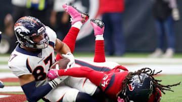 HOUSTON, TEXAS - DECEMBER 08: Noah Fant #87 of the Denver Broncos scores a touchdown in the first quarter as Jahleel Addae #37 of the Houston Texans defends at NRG Stadium on December 08, 2019 in Houston, Texas. (Photo by Tim Warner/Getty Images)