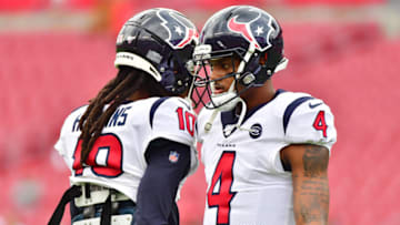 TAMPA, FLORIDA - DECEMBER 21: DeAndre Hopkins #10 and Deshaun Watson #4 of the Houston Texans warm up before a game against the Tampa Bay Buccaneers at Raymond James Stadium on December 21, 2019 in Tampa, Florida. (Photo by Julio Aguilar/Getty Images)