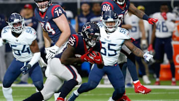 HOUSTON, TEXAS - DECEMBER 29: Duke Johnson #25 of the Houston Texans is pursued by Jayon Brown #55 of the Tennessee Titans during the first half at NRG Stadium on December 29, 2019 in Houston, Texas. (Photo by Bob Levey/Getty Images)