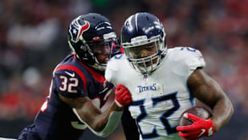 HOUSTON, TEXAS - DECEMBER 29: Derrick Henry #22 of the Tennessee Titans is pursued by Lonnie Johnson #32 of the Houston Texans during the first half at NRG Stadium on December 29, 2019 in Houston, Texas. (Photo by Tim Warner/Getty Images)