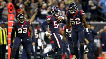 HOUSTON, TEXAS - JANUARY 04: Jacob Martin #54 of the Houston Texans is congratulated by his teammates Barkevious Mingo #52 and Brandon Dunn #92 after recovering a fumble against the Buffalo Bills during the fourth quarter of the AFC Wild Card Playoff game at NRG Stadium on January 04, 2020 in Houston, Texas. (Photo by Christian Petersen/Getty Images)