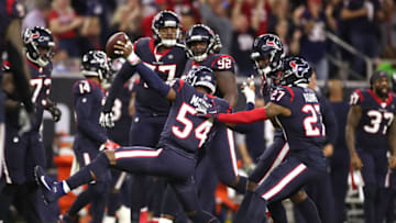 HOUSTON, TEXAS - JANUARY 04: Jacob Martin #54 of the Houston Texans is congratulated by his teammates after recovering a fumble against the Buffalo Bills during the fourth quarter of the AFC Wild Card Playoff game at NRG Stadium on January 04, 2020 in Houston, Texas. (Photo by Christian Petersen/Getty Images)