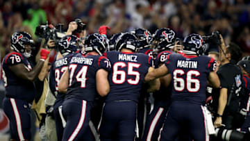 HOUSTON, TEXAS - JANUARY 04: Ka'imi Fairbairn #7 of the Houston Texans is congratulated by his teammates after his game-winning field goal in overtime to give his team the 22-19 win against the Buffalo Bills reacts in the AFC Wild Card Playoff game at NRG Stadium on January 04, 2020 in Houston, Texas. (Photo by Christian Petersen/Getty Images)