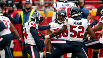 KANSAS CITY, MISSOURI - JANUARY 12: Jacob Martin #54, Peter Kalambayi #58 and Barkevious Mingo #52 of the Houston Texans celebrate a punt block for a touchdown against the Kansas City Chiefs during the first quarter in the AFC Divisional playoff game at Arrowhead Stadium on January 12, 2020 in Kansas City, Missouri. (Photo by Tom Pennington/Getty Images)