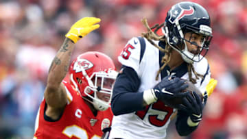 KANSAS CITY, MISSOURI - JANUARY 12: Will Fuller V #15 of the Houston Texans is tackled by Tyrann Mathieu #32 of the Kansas City Chiefs after a reception during the first quarter in the AFC Divisional playoff game at Arrowhead Stadium on January 12, 2020 in Kansas City, Missouri. (Photo by Jamie Squire/Getty Images)