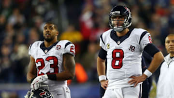 FOXBORO, MA - JANUARY 13: Matt Schaub #8 and Arian Foster #23 of the Houston Texans look on from the sideline against the New England Patriots during the 2013 AFC Divisional Playoffs game at Gillette Stadium on January 13, 2013 in Foxboro, Massachusetts. (Photo by Elsa/Getty Images)