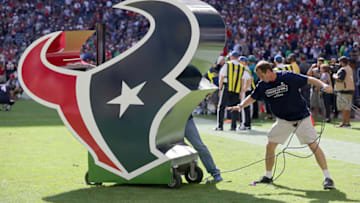 HOUSTON, TX - NOVEMBER 30: A worker moves the Houston Texans logo before the Houston Texans played the Tennessee Titans in a NFL game on November 30, 2014 at NRG Stadium in Houston, Texas. (Photo by Thomas B. Shea/Getty Images)